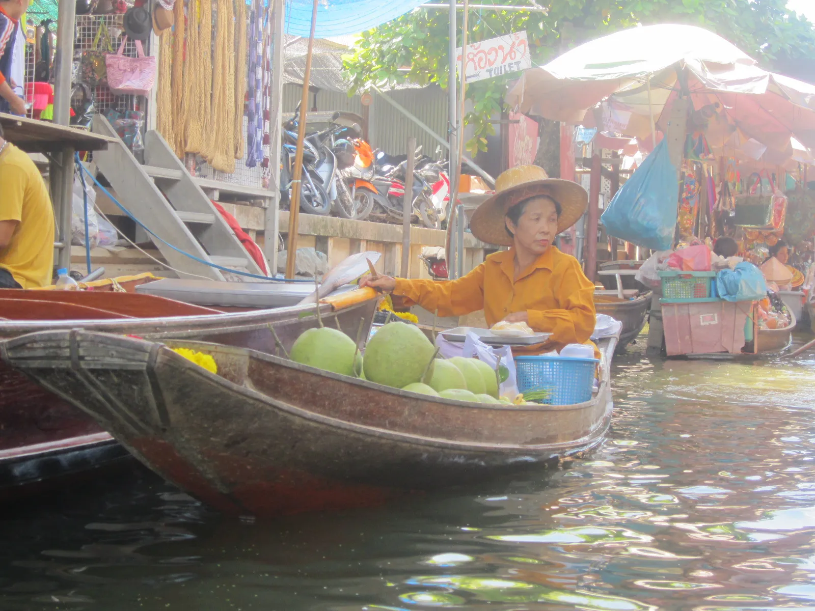 Vendor boat selling fruit at a floating market near Bangkok