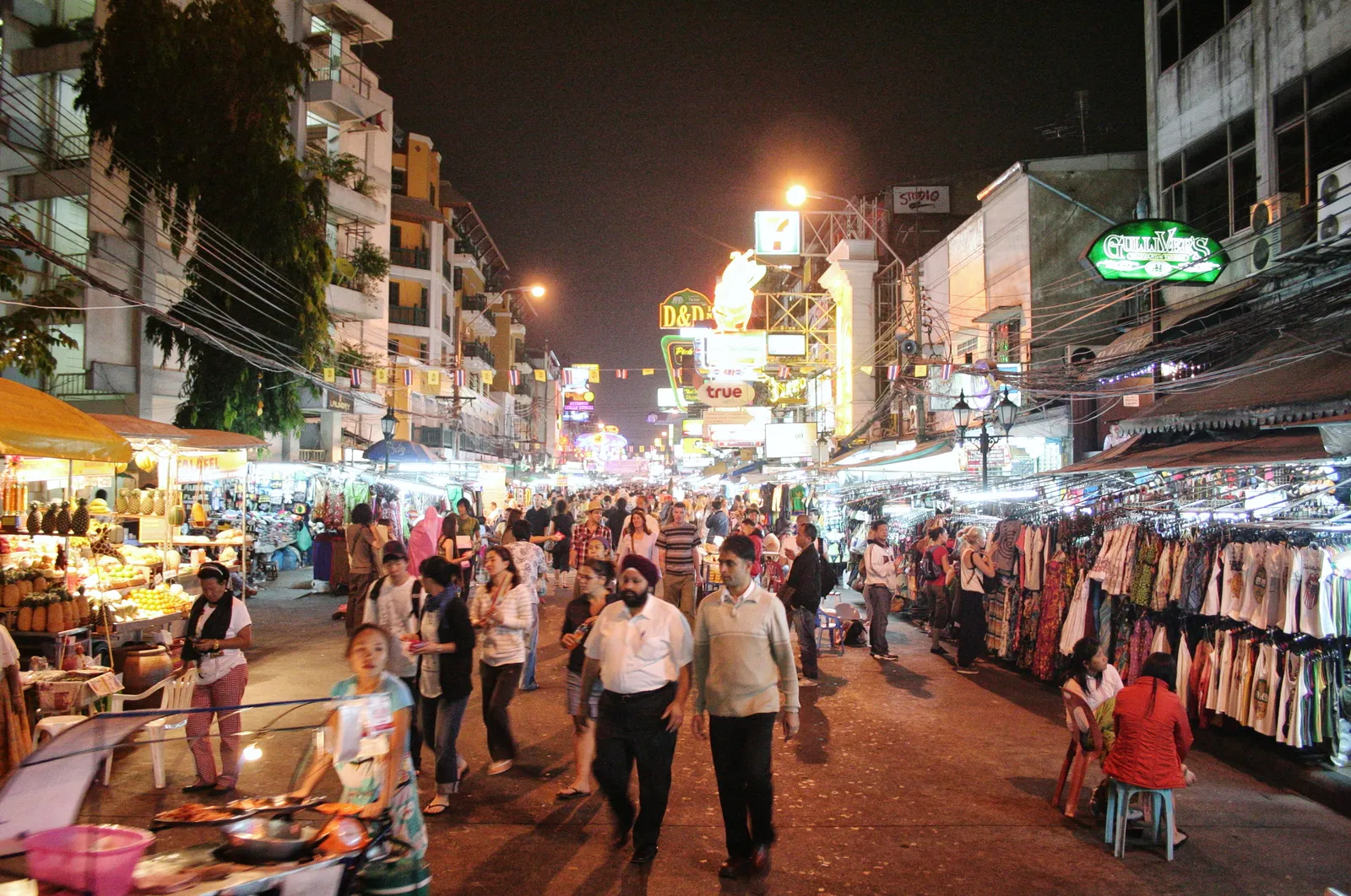 Khao San Road at night with bar crowds and neon, Bangkok
