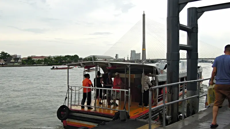 Passengers waiting at a Chao Phraya river pier