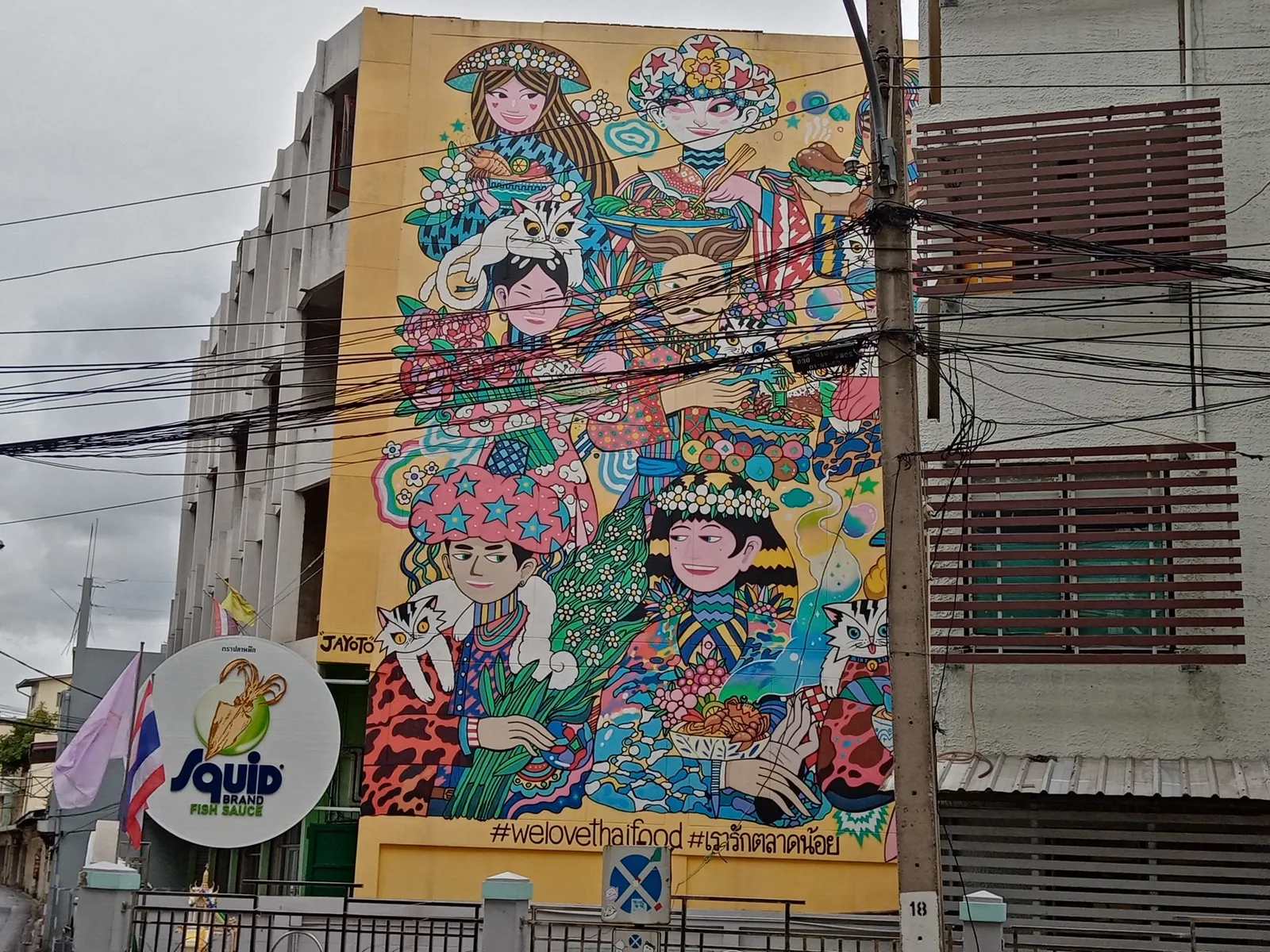 Street art and a vintage car in Bangkok's Talat Noi neighborhood