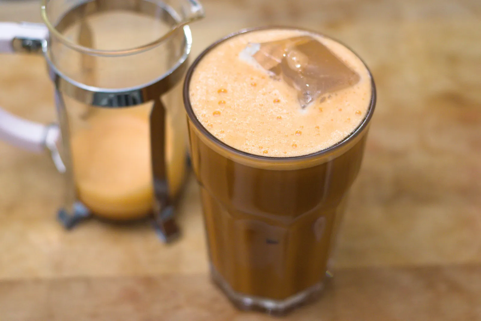 Thai iced tea and coffee on a café table in Bangkok